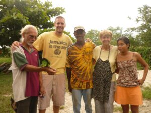 Julio with parrot Lolo, volunteer, Mac, Karin, and Roxanna